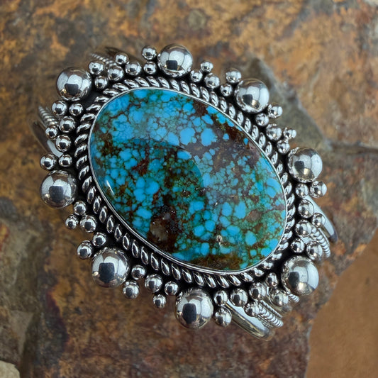 Kingman Turquoise Cuff Bracelet by Artie Yellowhorse - top view showing oval spiderweb turquoise and silver bead halo