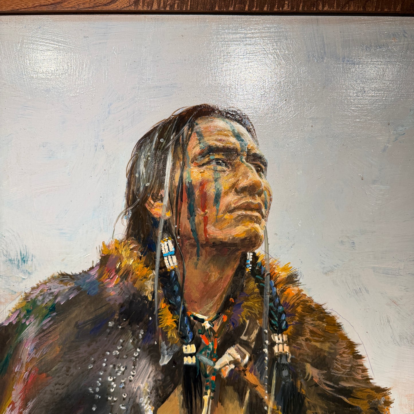 Artistic depiction of a Native American figure with intricate details on a textured background