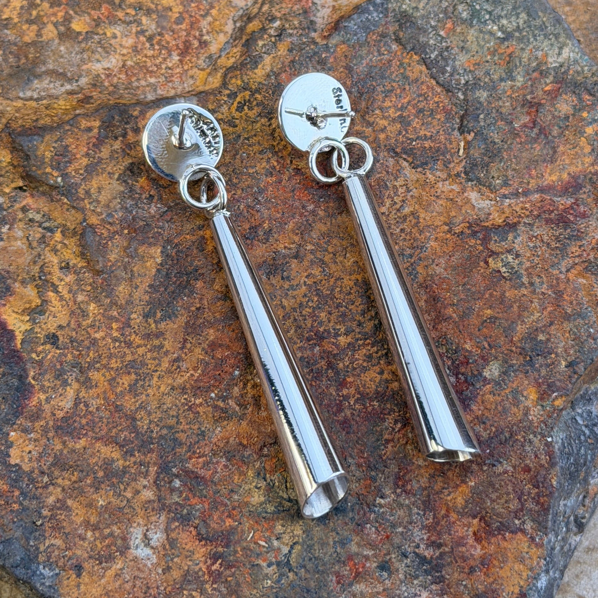 Traditional cone shaped drop Sterling Silver Earrings by Artie Yellowhorse stamping