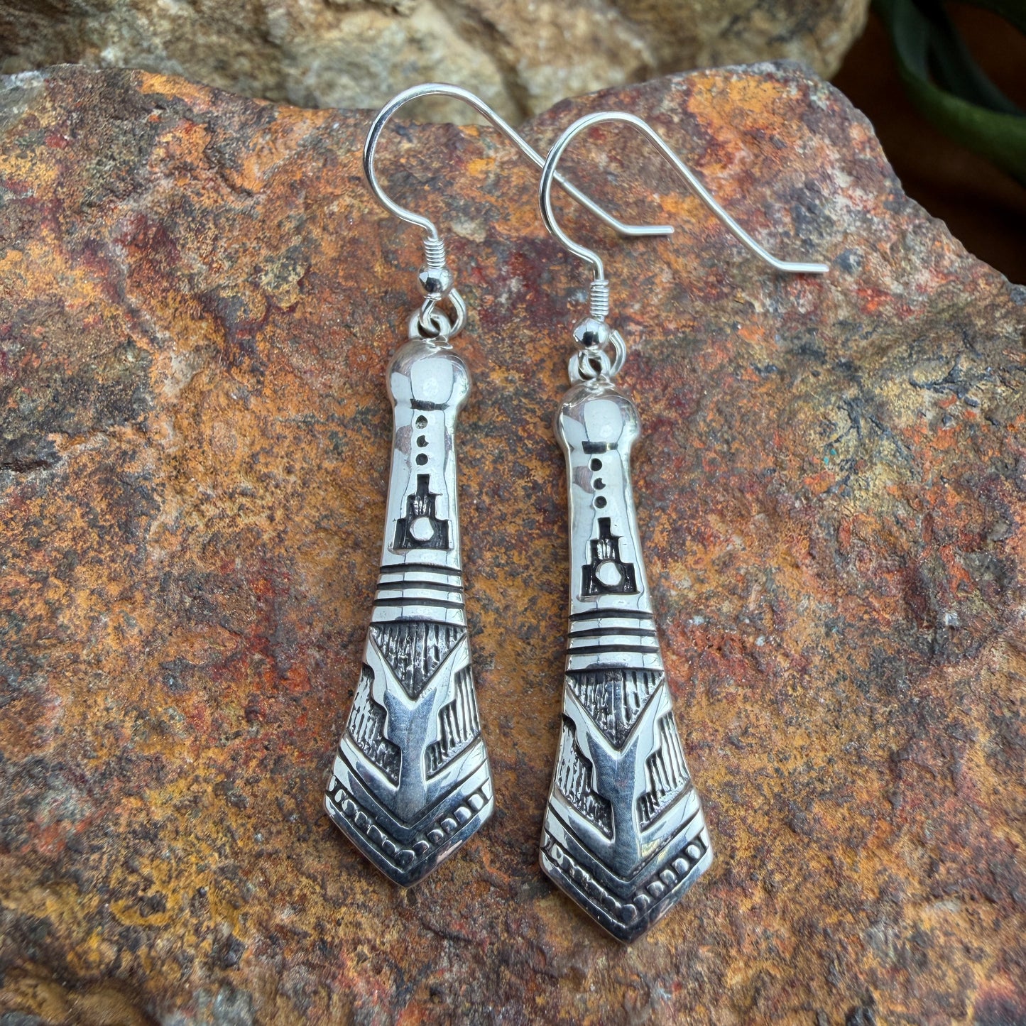 Silver earrings with intricate stamped design