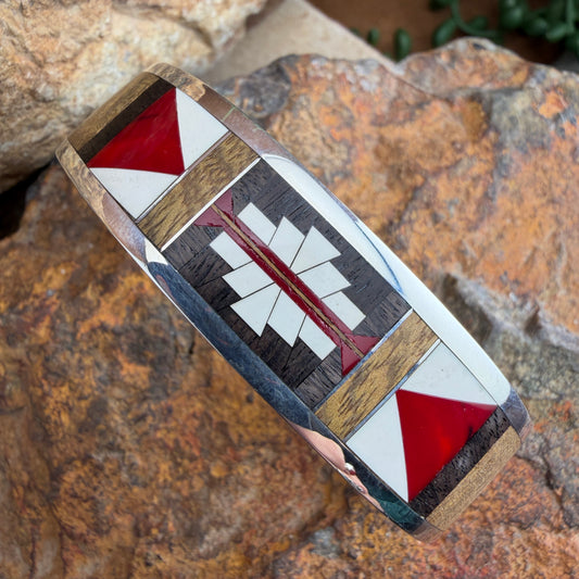 Silver cuff bracelet with red, brown and white geometric pattern
