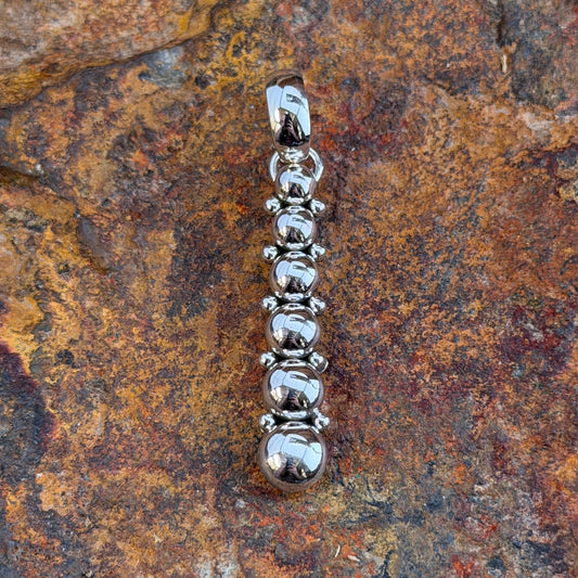 six sphere silver pendant showing Artie Yellowhorse