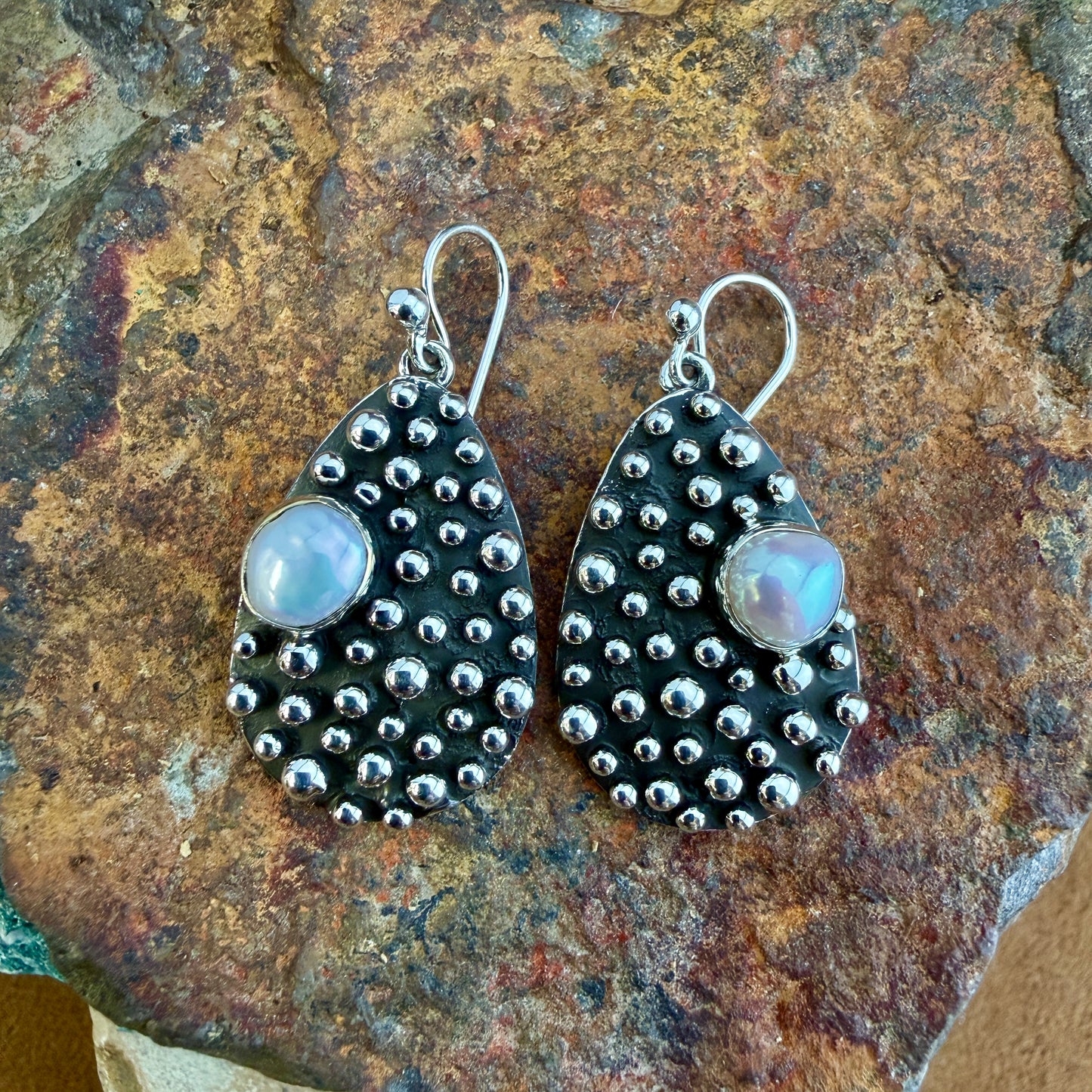 Million Drops Fresh Water Pearl Sterling Silver Earrings by Ray Coriz - angled view showing dimensional hand-soldered silver spheres and pearl cabochon