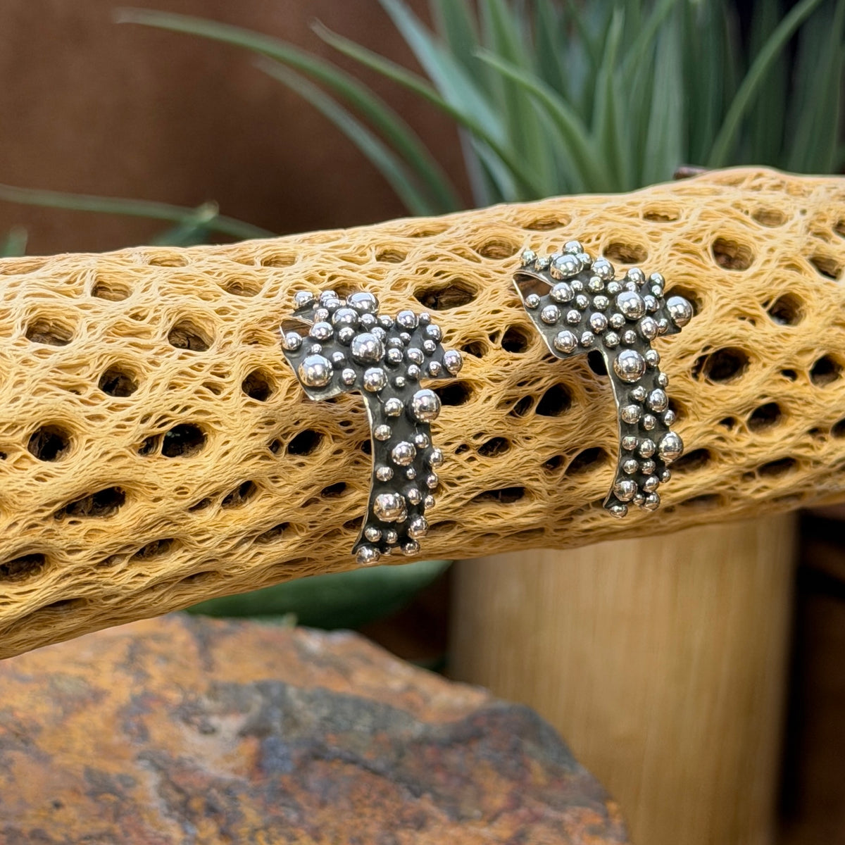 A. Douglas sterling silver beaded cross earrings, angled view