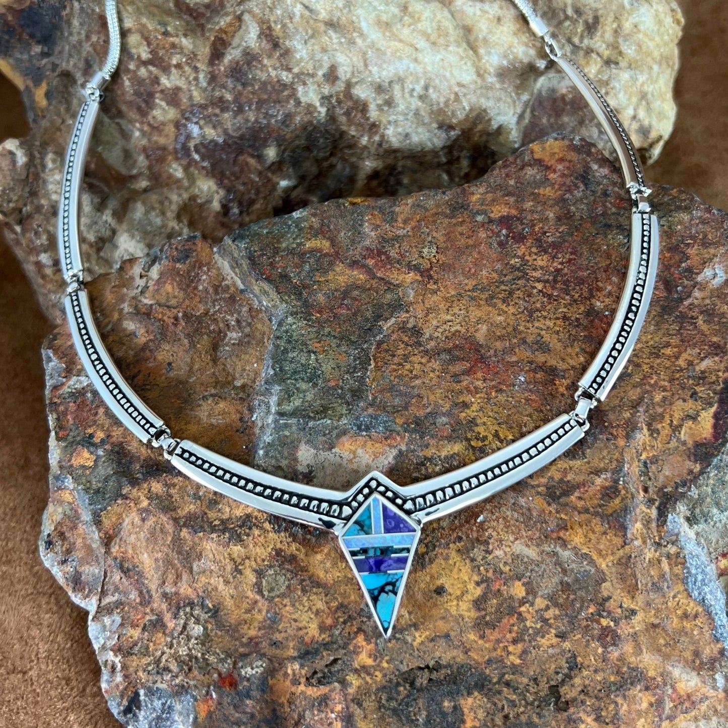 as part of the Shalako Collection features Sugilite, Tibetan Turquoise and Lap Opal.