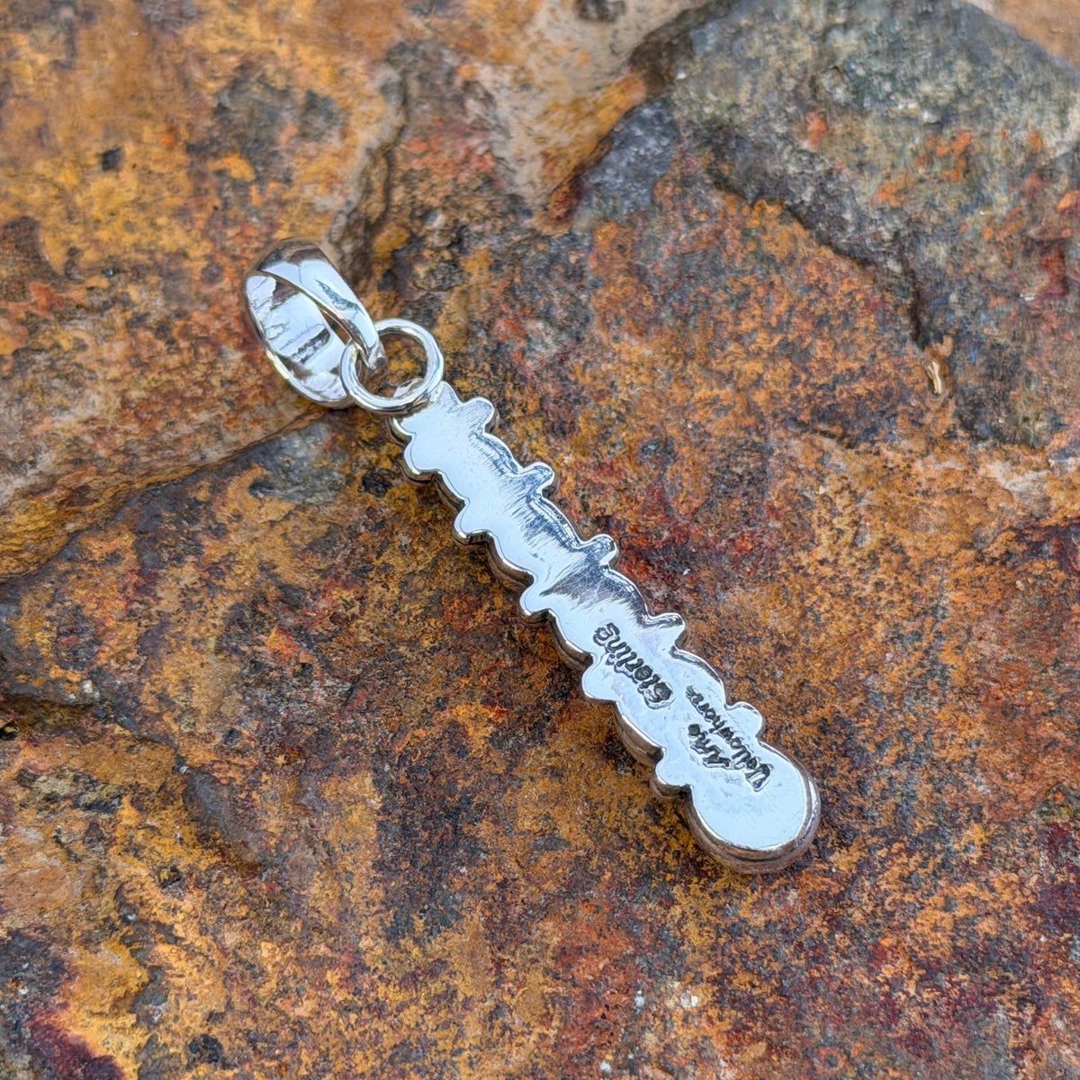 six sphere silver pendant showing Artie Yellowhorse