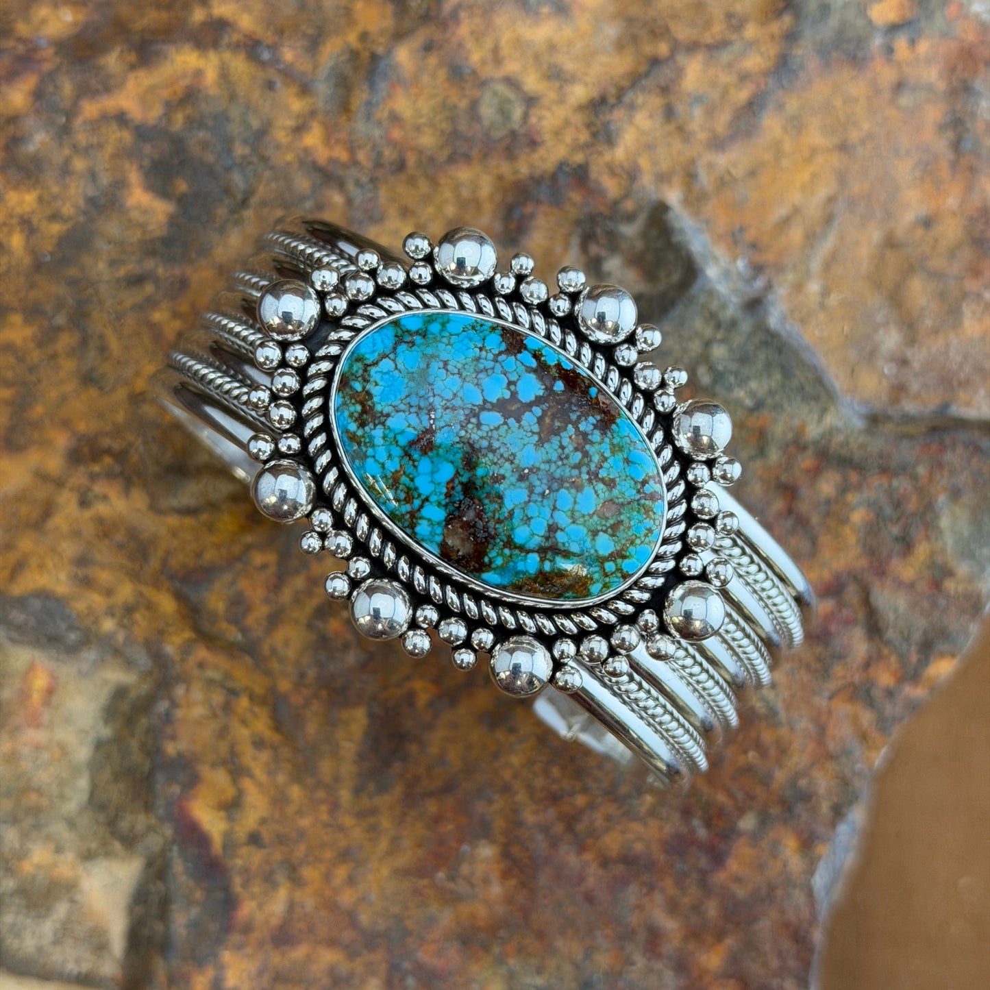 Kingman Turquoise Cuff Bracelet by Artie Yellowhorse - angled view showing multi-wire twisted rope band