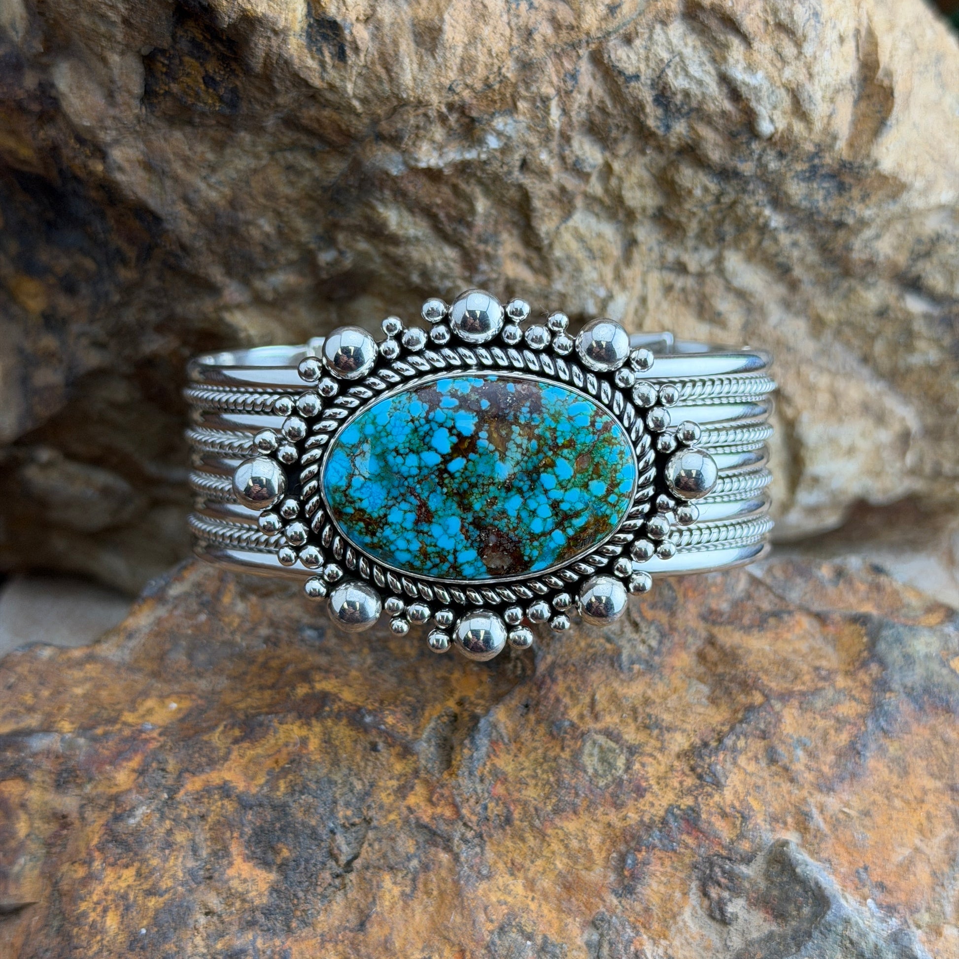 Kingman Turquoise Cuff Bracelet by Artie Yellowhorse - front view showing stone face and graduated silver bead surround