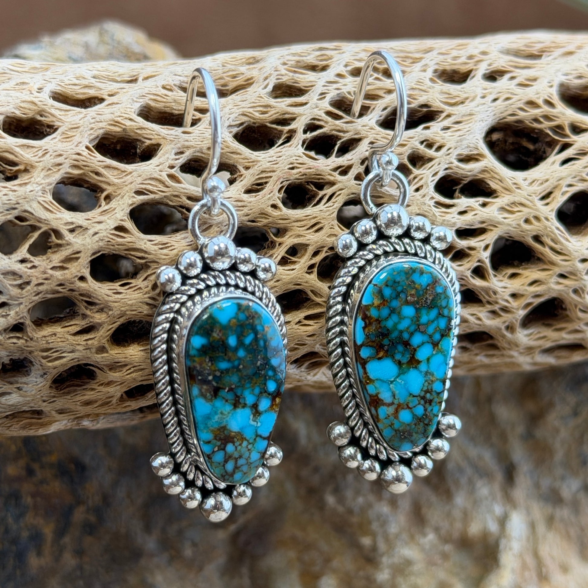 Kingman Turquoise Dangle Earrings by Artie Yellowhorse - angled view showing twisted rope border and French hook wires