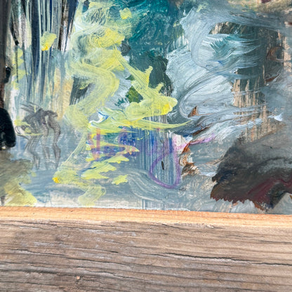 Framed painting of a forest scene with a person walking.