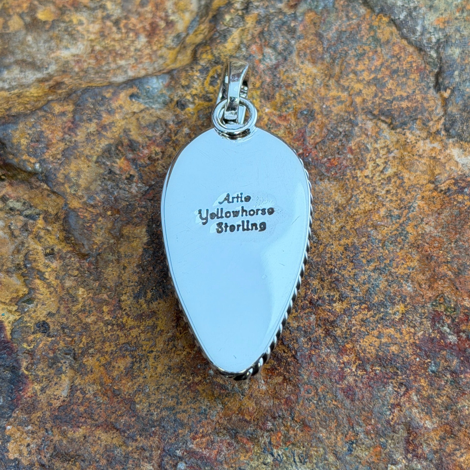 Black Onyx Pendant by Artie Yellowhorse - reverse showing Artie Yellowhorse Sterling hallmark stamp