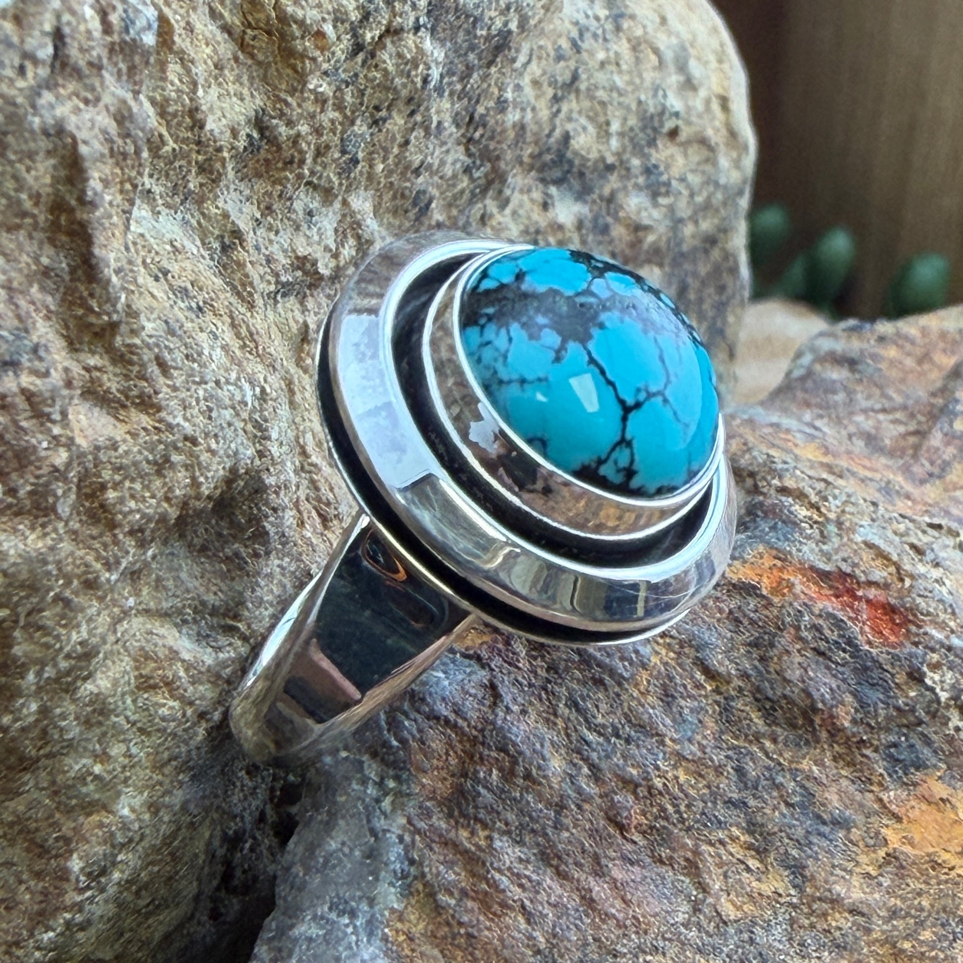 Chinese Turquoise Ring by Artie Yellowhorse - side view showing crescent silver surround and polished shank