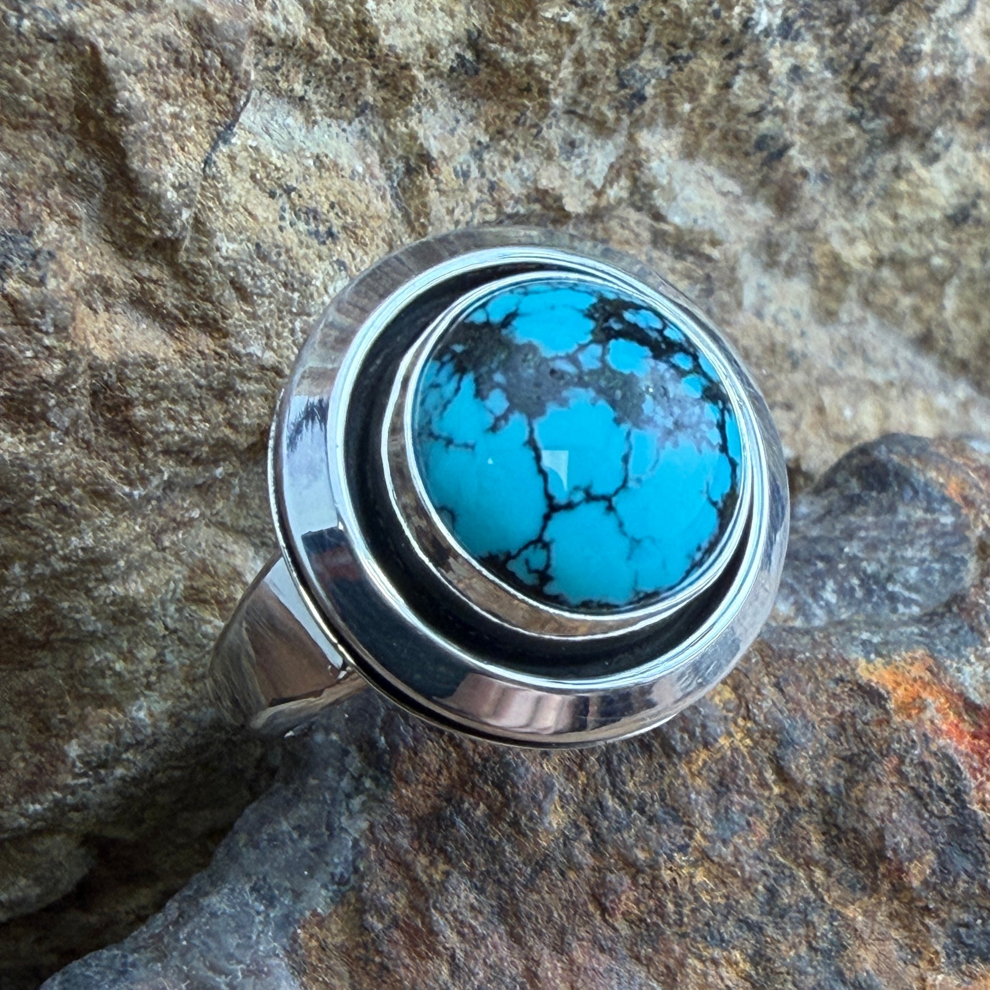 Chinese Turquoise Ring by Artie Yellowhorse - top view showing round turquoise cabochon with dark matrix
