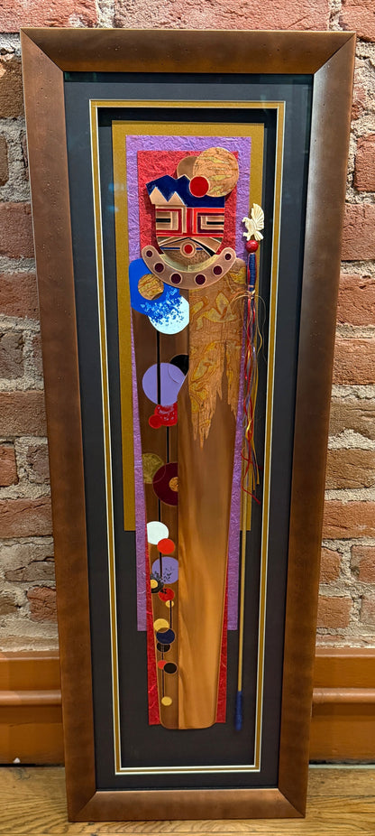 Framed artwork with abstract design on a brick wall background