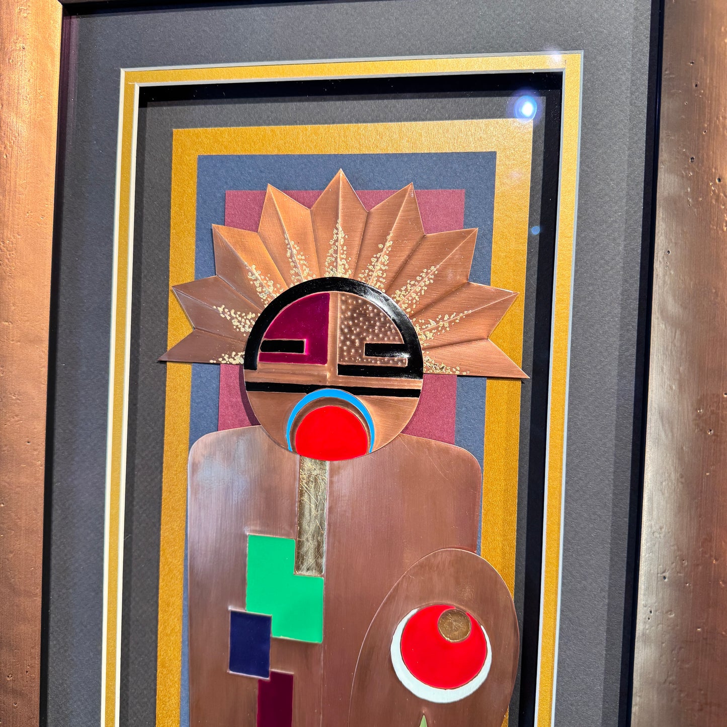 Abstract art piece with geometric shapes and a prominent circular design.
