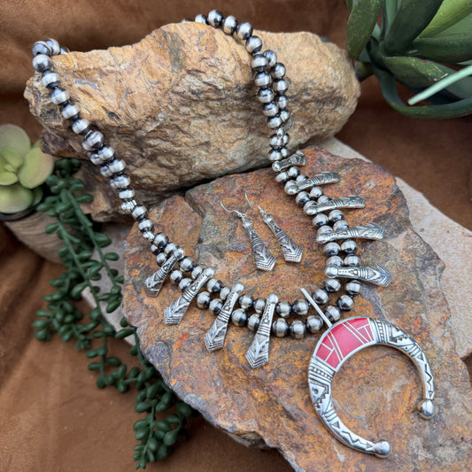  double chained Silver beaded necklace with stamped triangular beads. With silver stamped center piece, inlaid with red