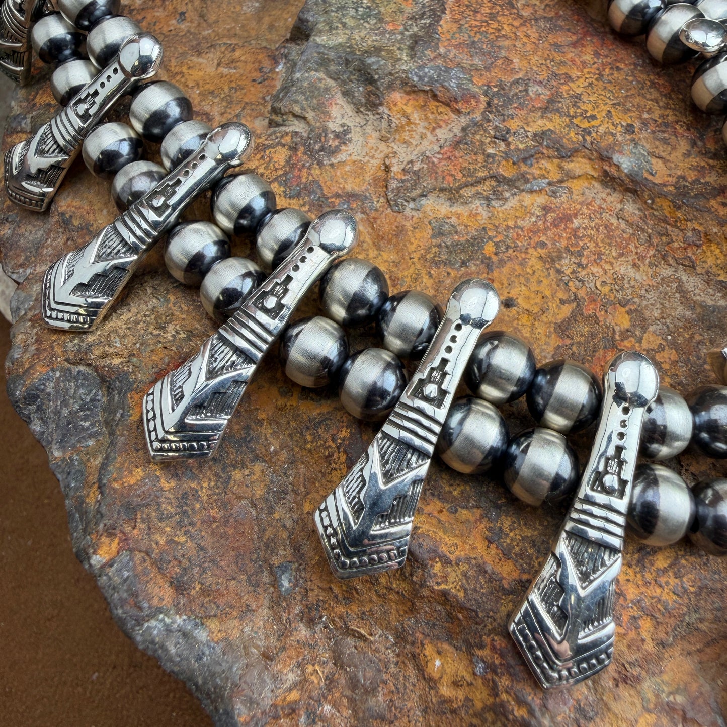Silver beaded necklace with decorative elements 