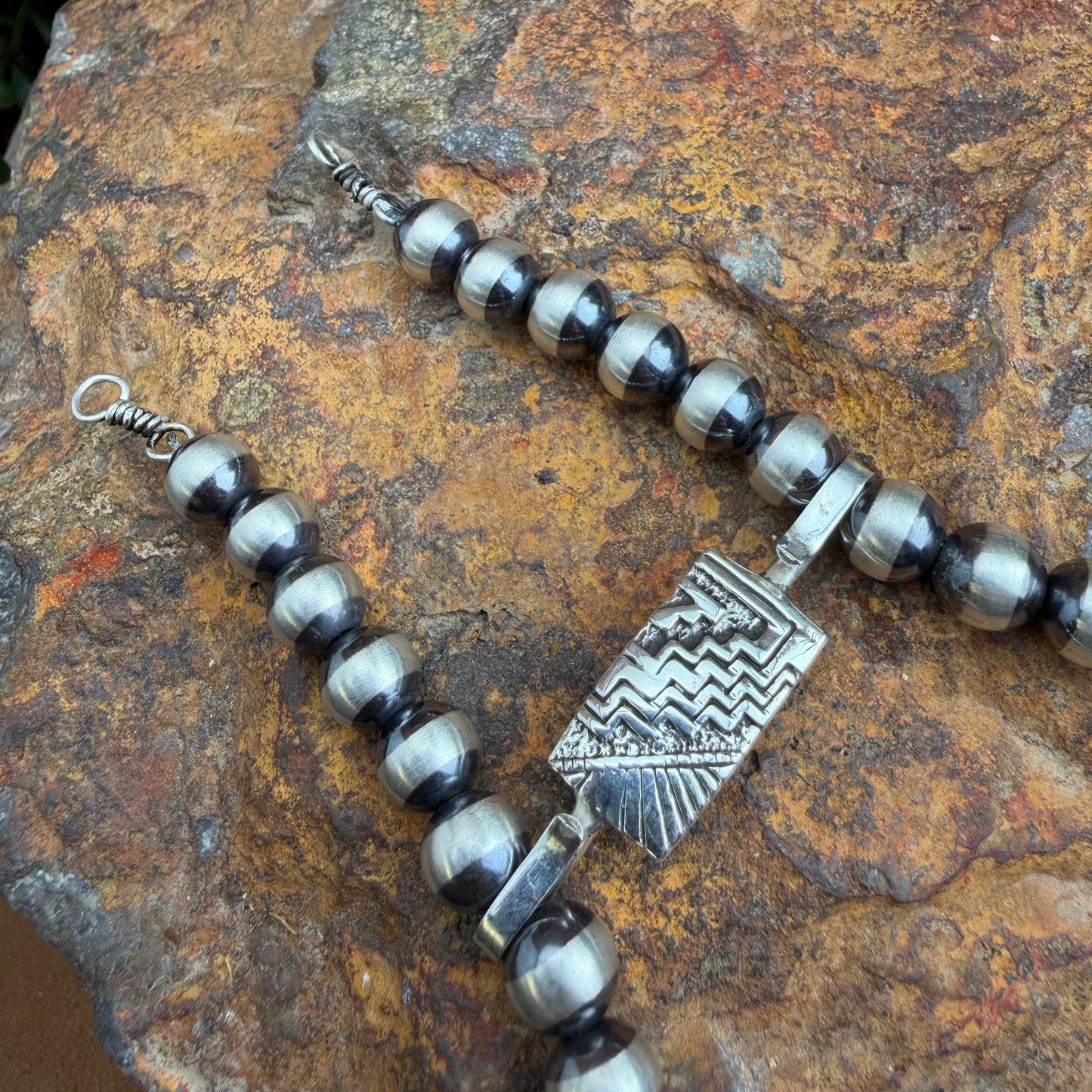 Silver clasp with intricate design