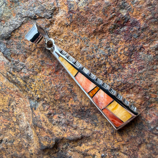 various orange stone pendant on a  triangular pendant