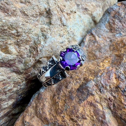 Silver stamp worked ring a purple gemstone 