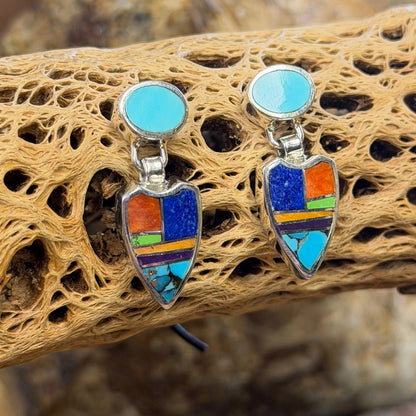 Pair of drop post earrings that are sterling Silver Earings with blue, orange, purple, green stones inlaid throughout