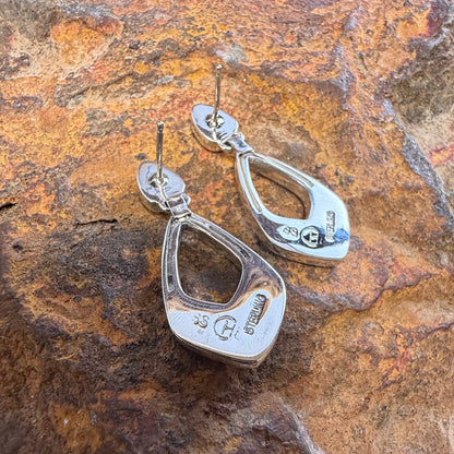 the back of a Pair of Sterling Silver Drop Post Featuring Stamping "SS""Sterling"