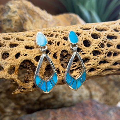 Pair of Sterling Silver Drop Post earrings That feature light blue stone inlay