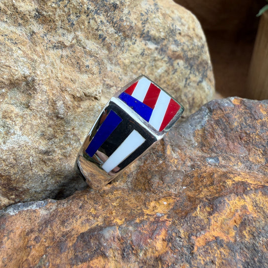 Ring with a flag design, placed on a rocky surface