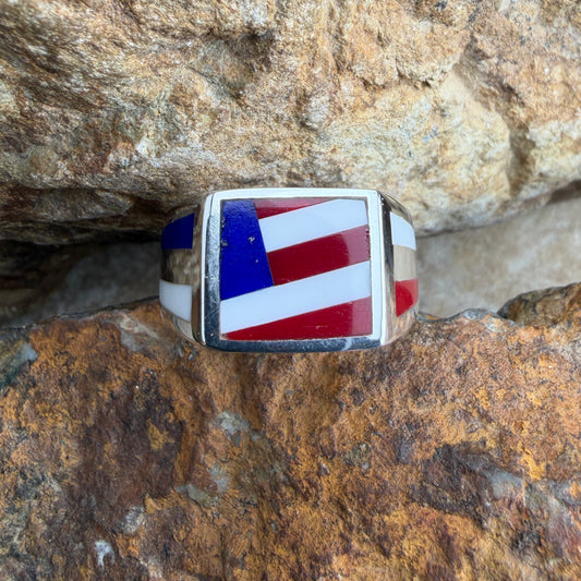 Ring with American flag design, placed on a rocky surface