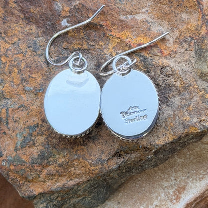 Front view of oval denim-blue lapis dangle earrings with twisted-rope sterling silver borders