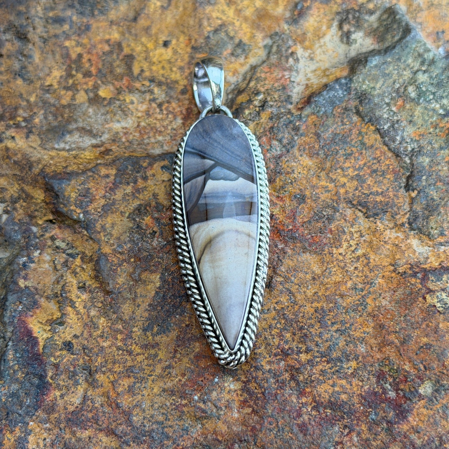 Deschutes Jasper Pendant by Artie Yellowhorse - front view showing full lance-shaped cabochon with cream and charcoal banding