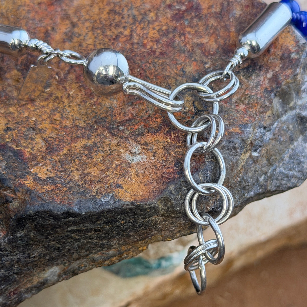 Full view of the double-strand necklace with round lapis beads and sterling silver clasp