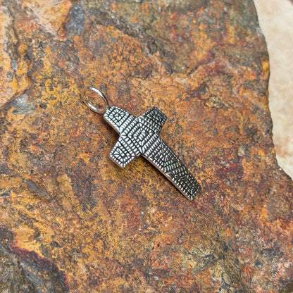 Geometric detailing on Elgin Tom all-silver cross pendant
