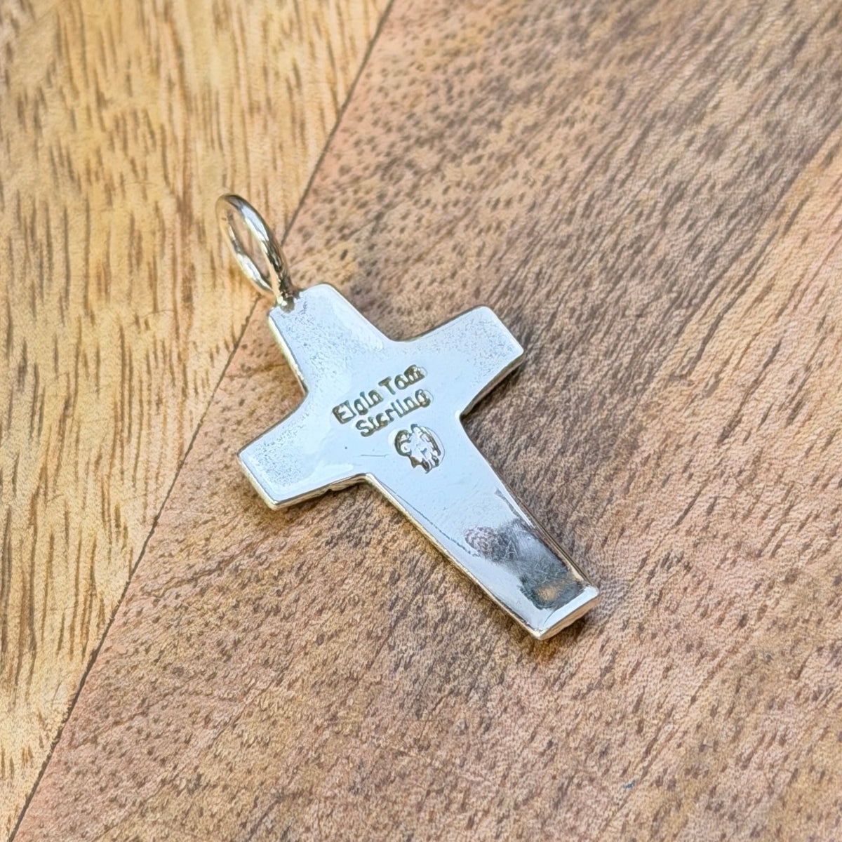 back of elgin tom sterling silver cross pendant showcasing stamping