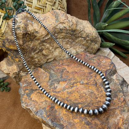 Lobster clasp and two-inch extender on graduated Navajo pearl necklace