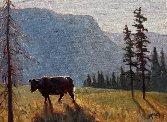 An oil painting of a dark brown cow standing in a grassy field, framed by tall pine trees in the foreground and a large blue mountain in the background under a pale sky.