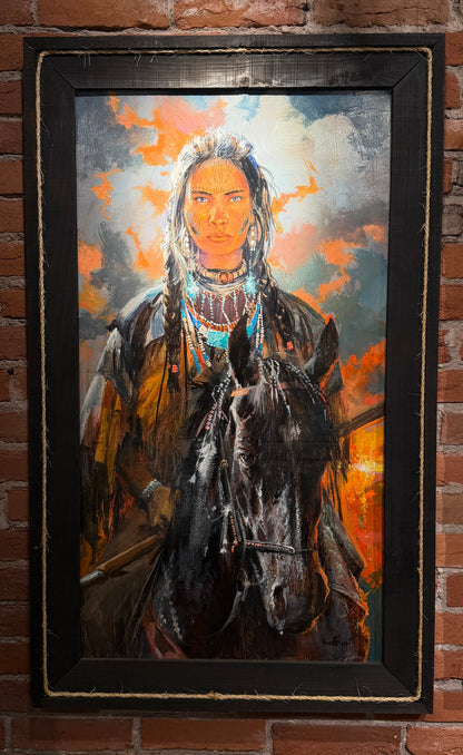 Framed painting of a person on horseback against a brick wall 