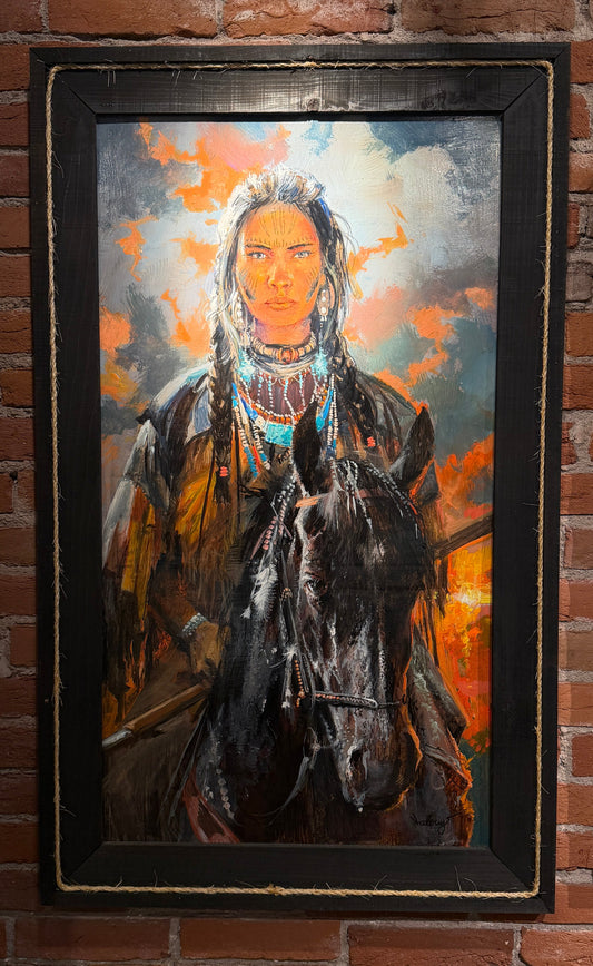 Framed painting of a person on horseback against a brick wall 