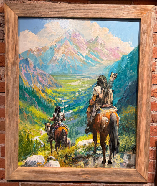 Painting of two figures on horseback in a mountainous landscape, framed in a rustic wooden frame.