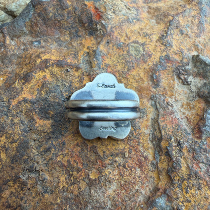 back of a silver ring with stamping. 
"E. Enoah" and "sterling"