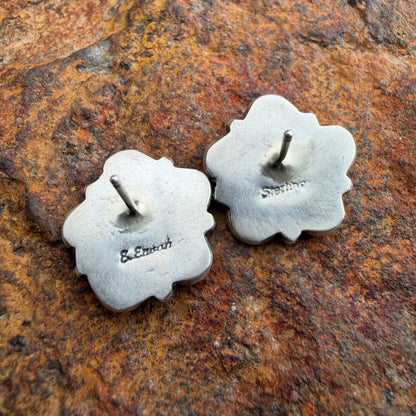  back of a pair of silver floral stamped Sterling and E.Enoah
