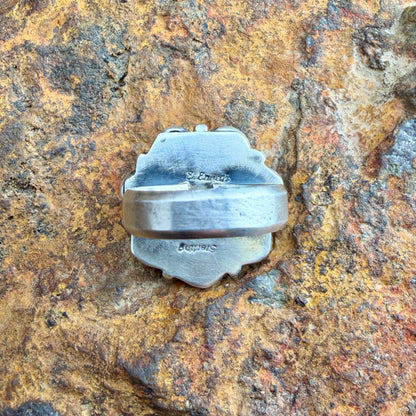 Back of a ring with hand stamping "Sterling" and "E.Enoah"