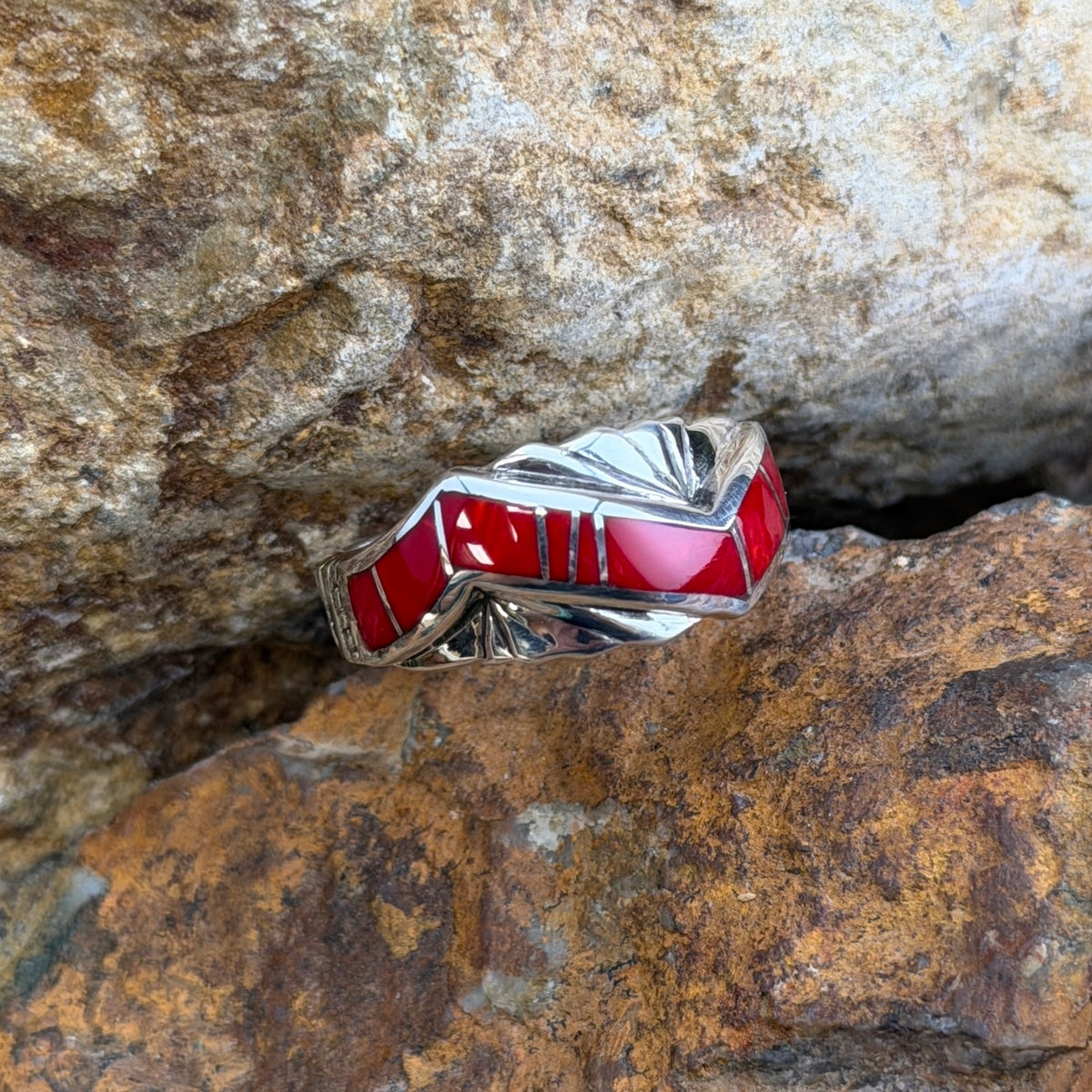 Front view of red Rosarita inlay divided by narrow sterling silver lines