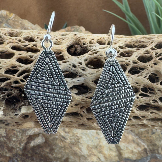 Traditional Sterling Silver Earrings by Elgin Tom
