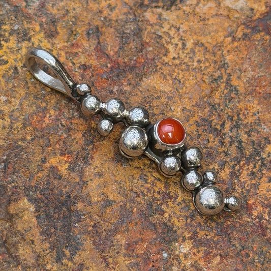 Ray Coriz Million Drops coral sterling silver pendant, angled front view