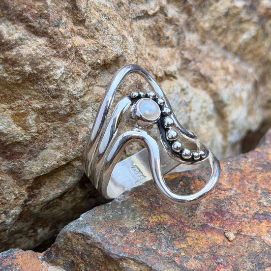 Ray Coriz sterling silver wave ring with white freshwater pearl and rounded silver accents, front view