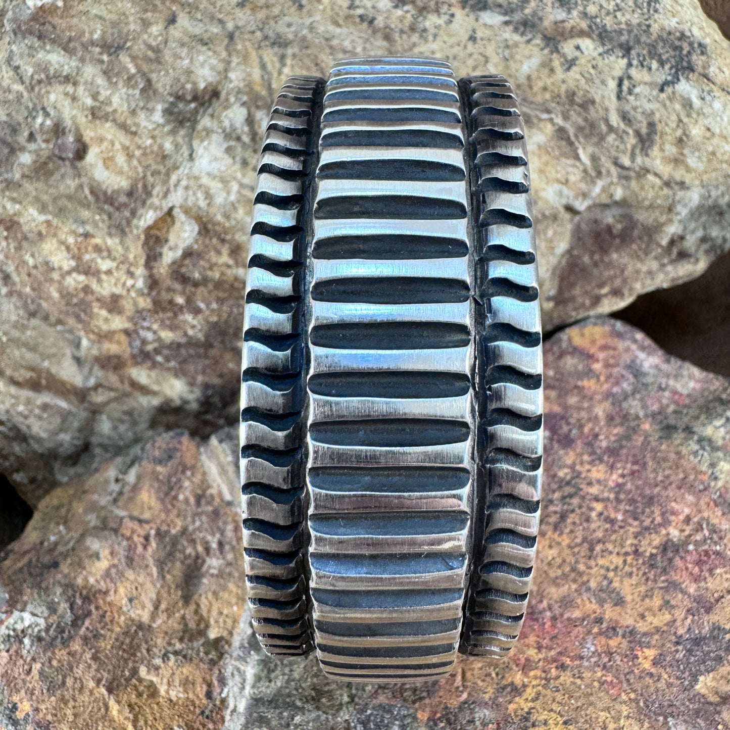 Sterling Silver Ribbed Cuff Bracelet with Hidden Sunburst Design by Elvira Bill