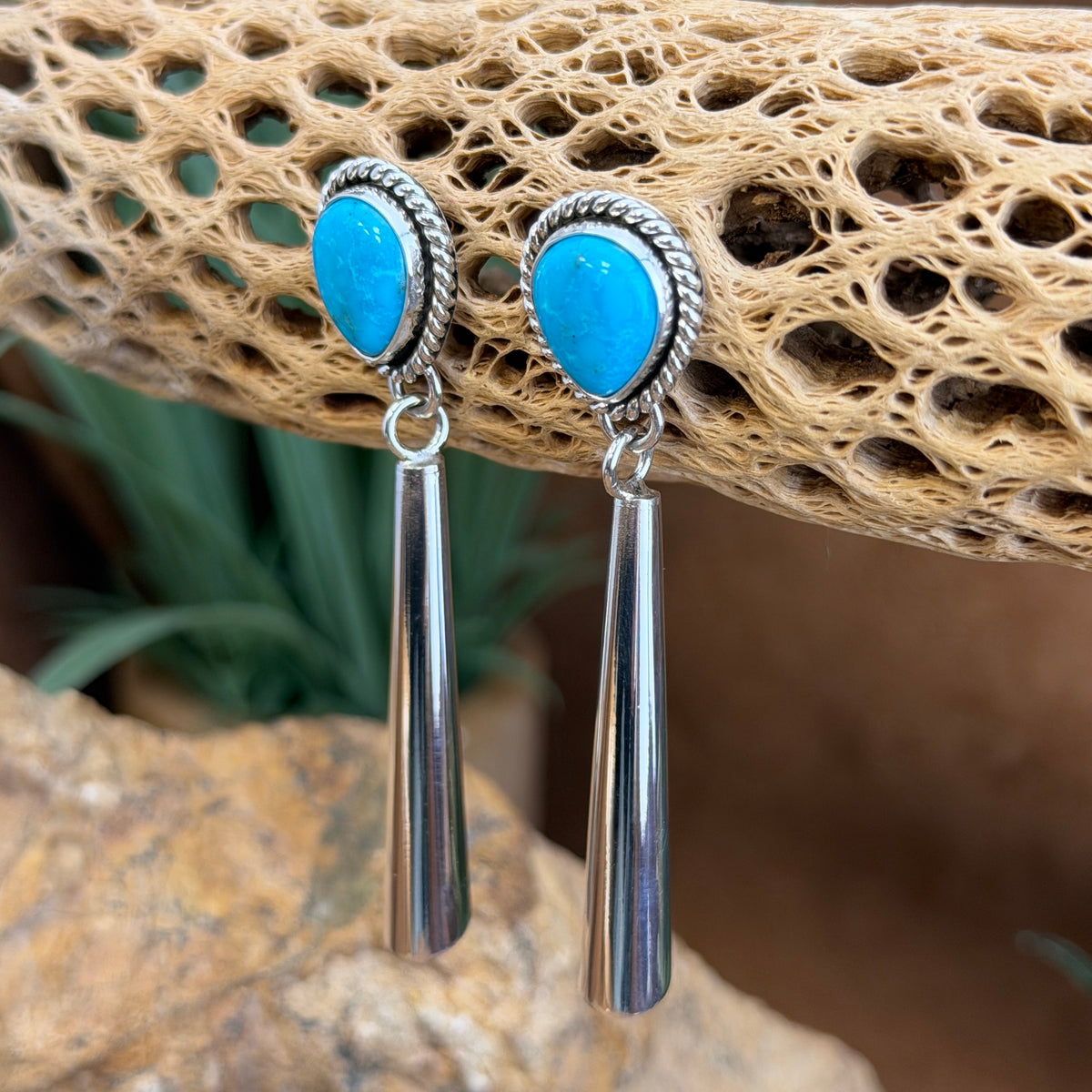 Front of Kingman turquoise teardrop posts and tapered sterling silver dangles