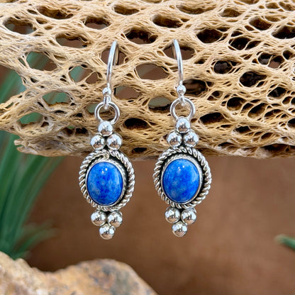 Alternate view of sterling silver lapis dangle earrings with polished bead accents