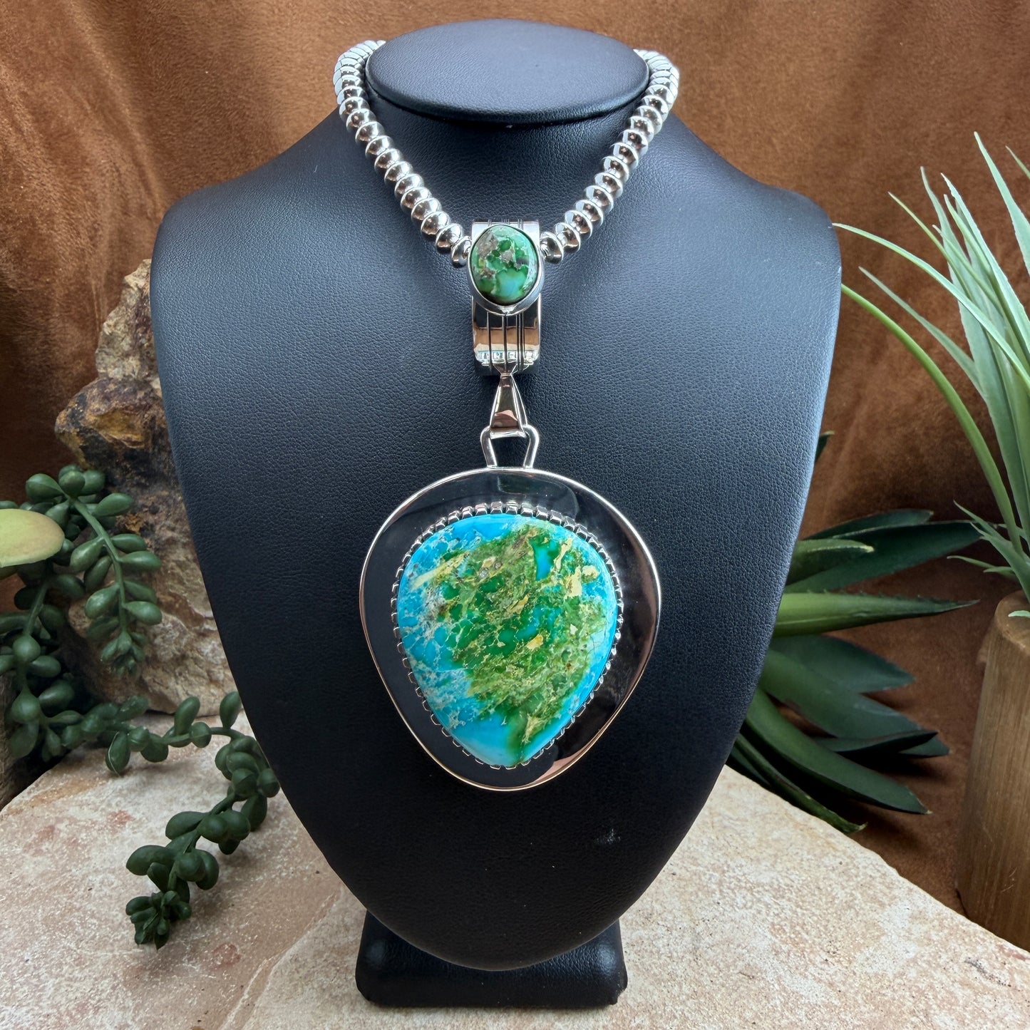 Necklace with green and blue stoned pendant 